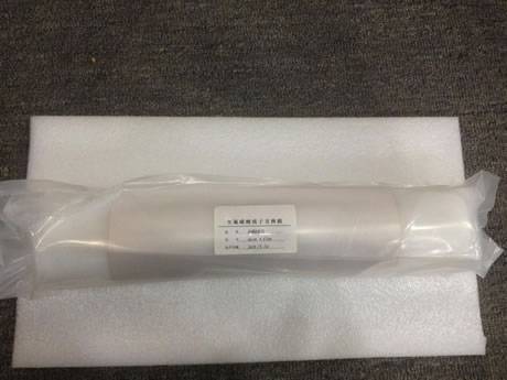There is a fuel cell membrane roll put on a soft mat and wrapped with plastic film.